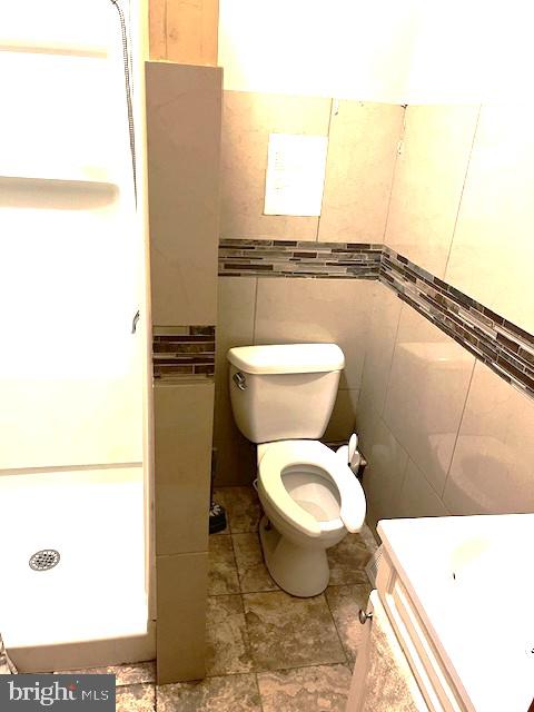 912 Point Street Camden, NJ 08102 - Photo 9 of 10 a bathroom with a toilet a sink and a window
