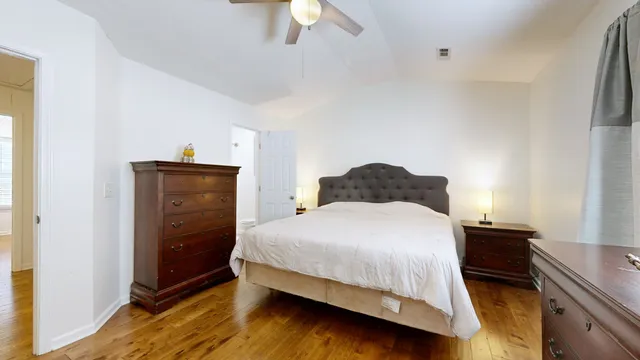 a bedroom with a bed and a dresser