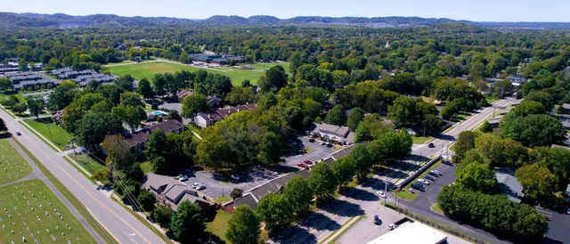 an aerial view of residential house and outdoor space