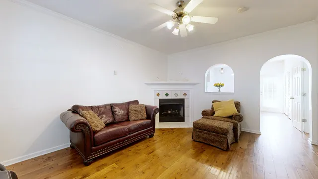 a living room with furniture and a fireplace