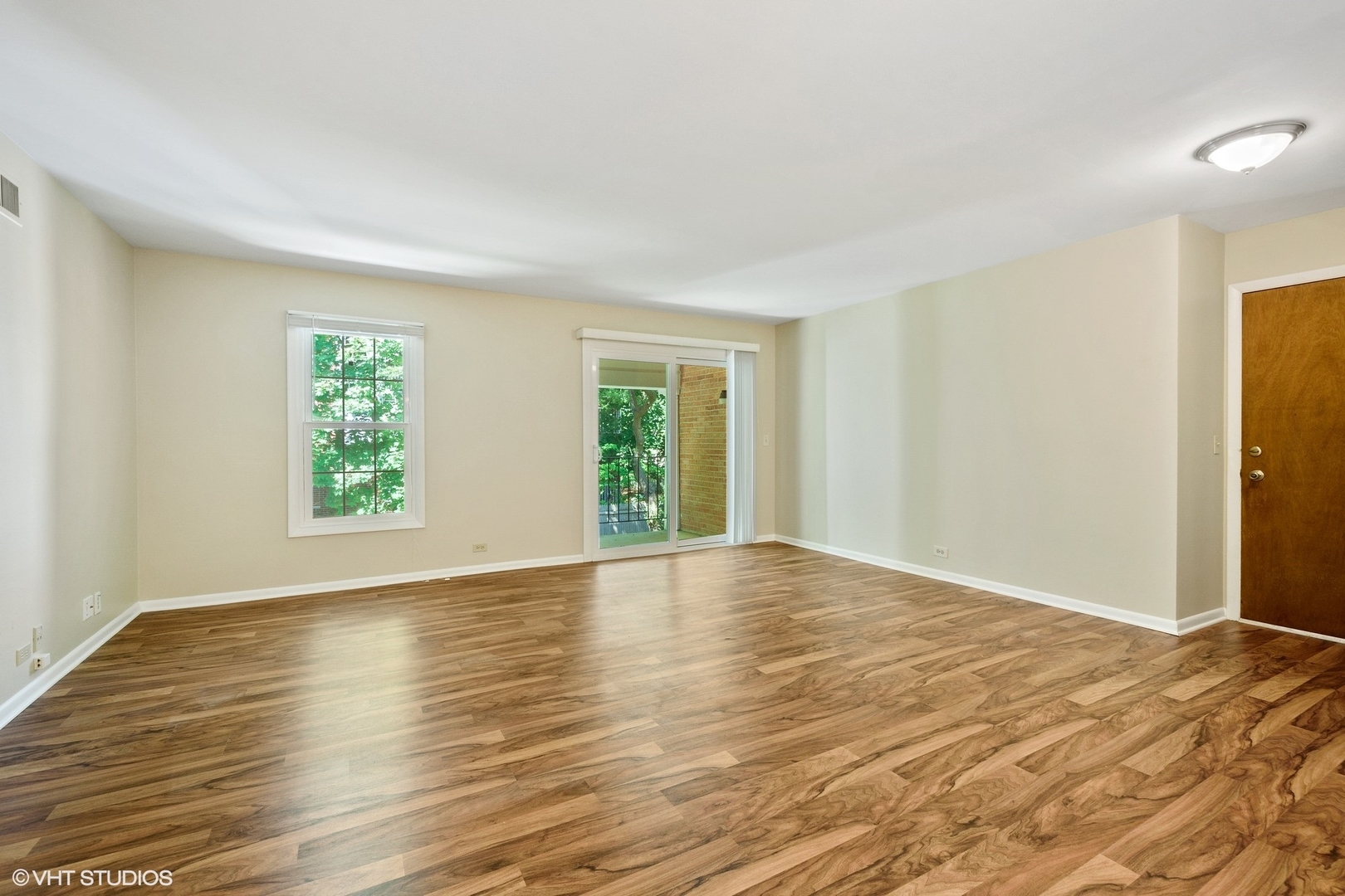 520 Shorely Drive, Unit 201 Barrington, IL 60010 - Photo 2 of 12 a view of empty room with wooden floor and fan