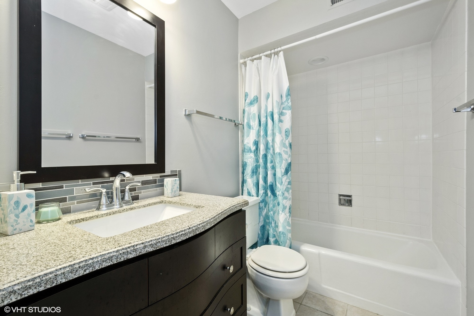 520 Shorely Drive, Unit 201 Barrington, IL 60010 - Photo 7 of 12 a bathroom with a granite countertop sink toilet and shower