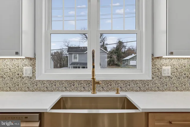 a view of a sink and a microwave