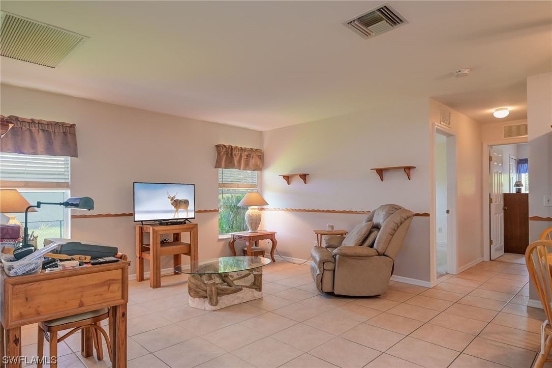 819 Rue Labeau Circle Fort Myers, FL 33913 - Photo 10 of 31 a living room with furniture and a window