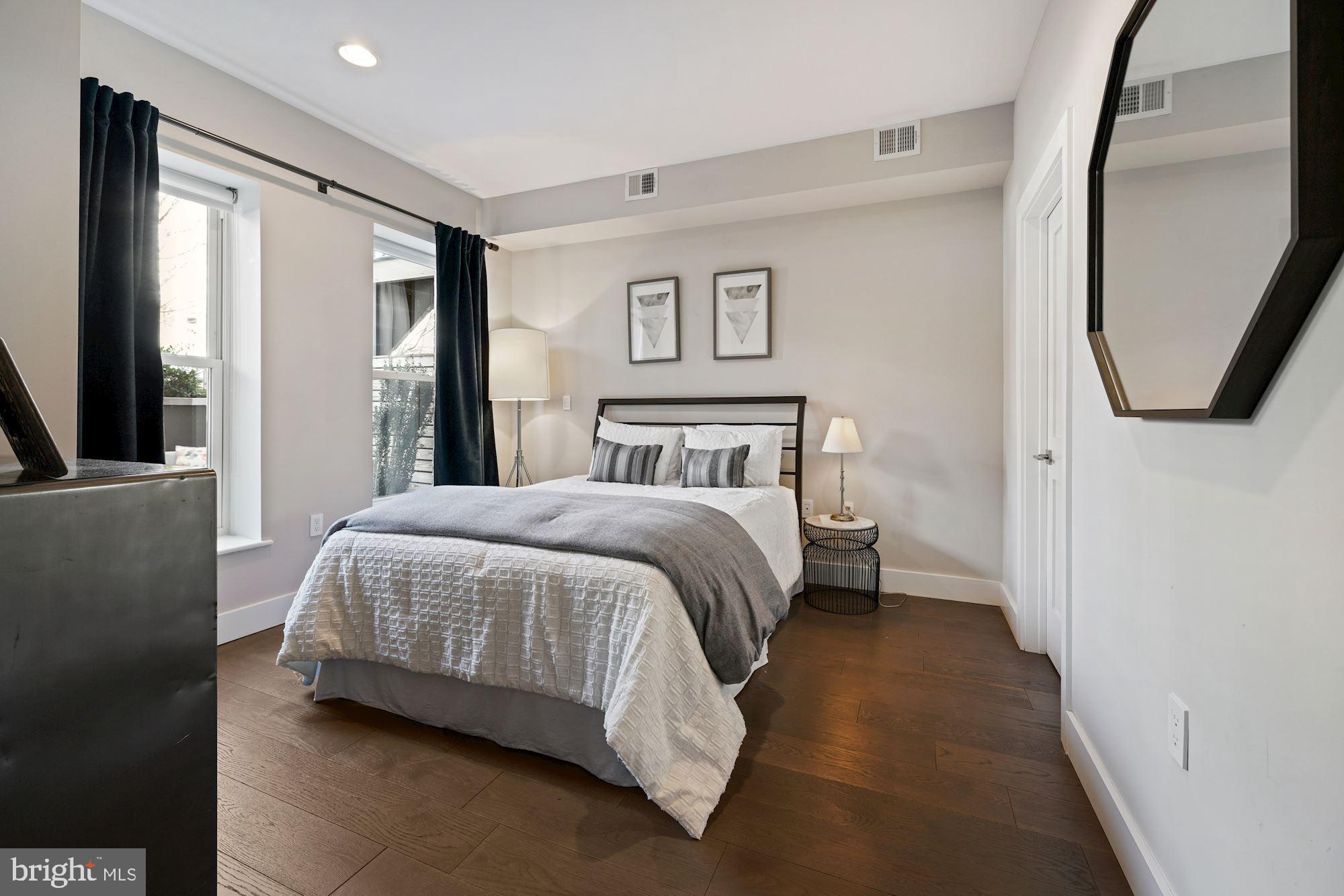 217 Randolph Place Northeast, Unit 1 Washington, DC 20002 - Photo 11 of 26 Main level bedroom with large windows