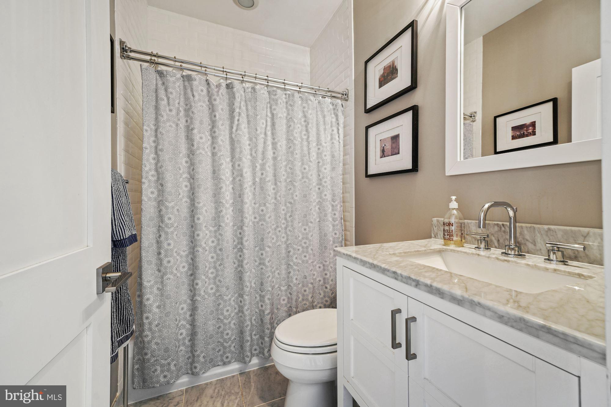 217 Randolph Place Northeast, Unit 1 Washington, DC 20002 - Photo 12 of 26 Main level full bathroom