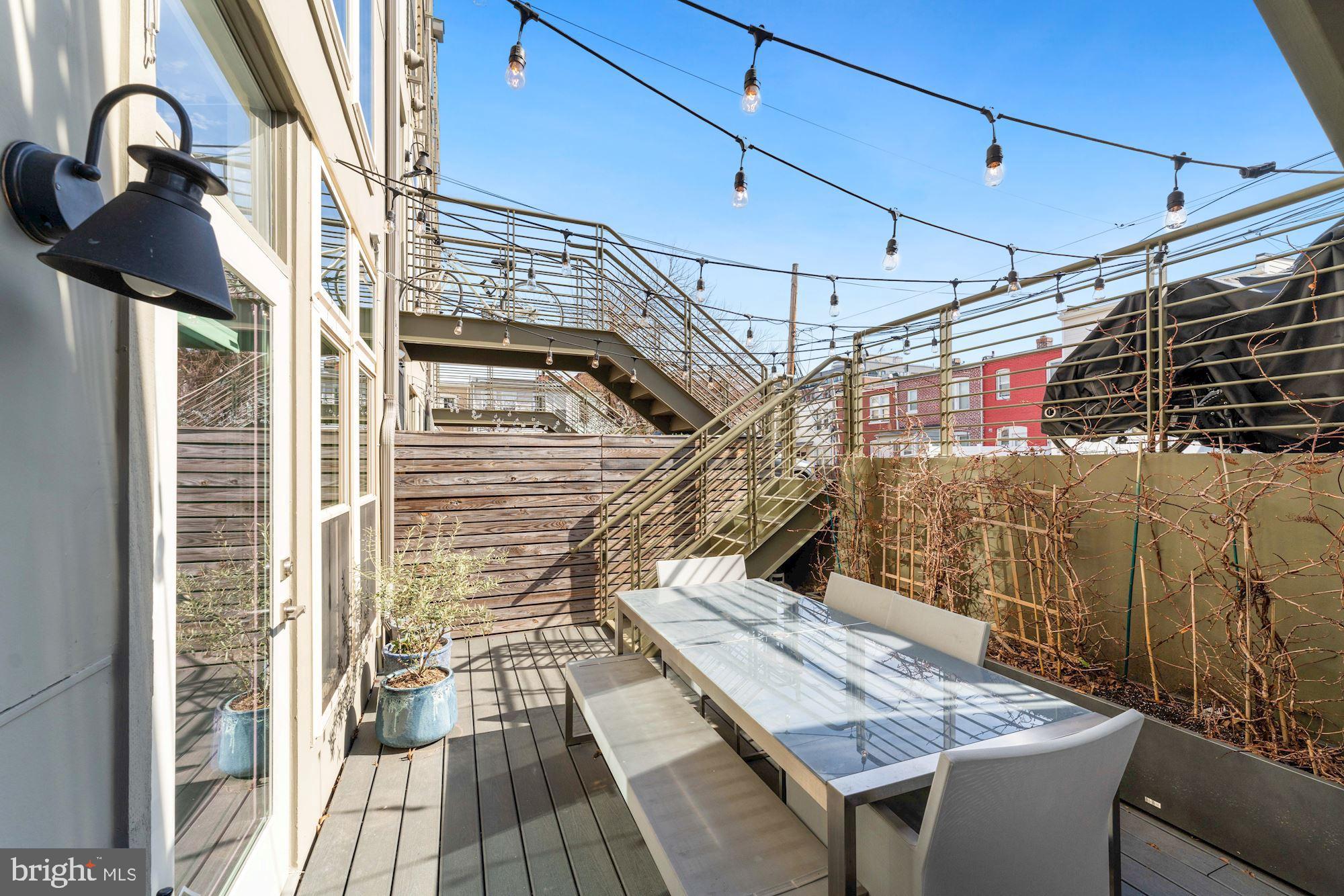 217 Randolph Place Northeast, Unit 1 Washington, DC 20002 - Photo 25 of 26 Back patio with access to assigned parking