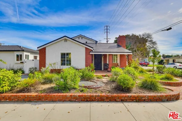 front view of a house with a small yard