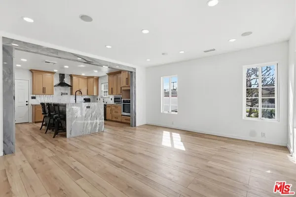a view of kitchen with furniture and window