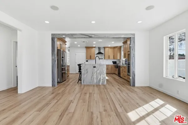a view of a living room and dining room