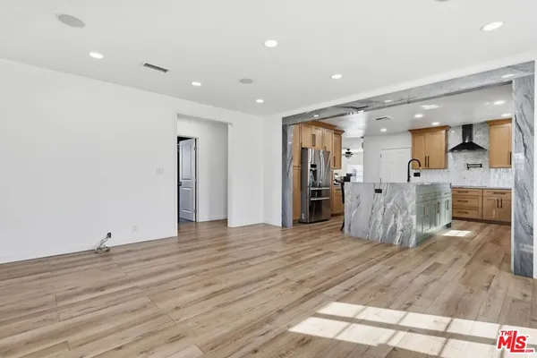 a view of a kitchen with a sink and cabinets
