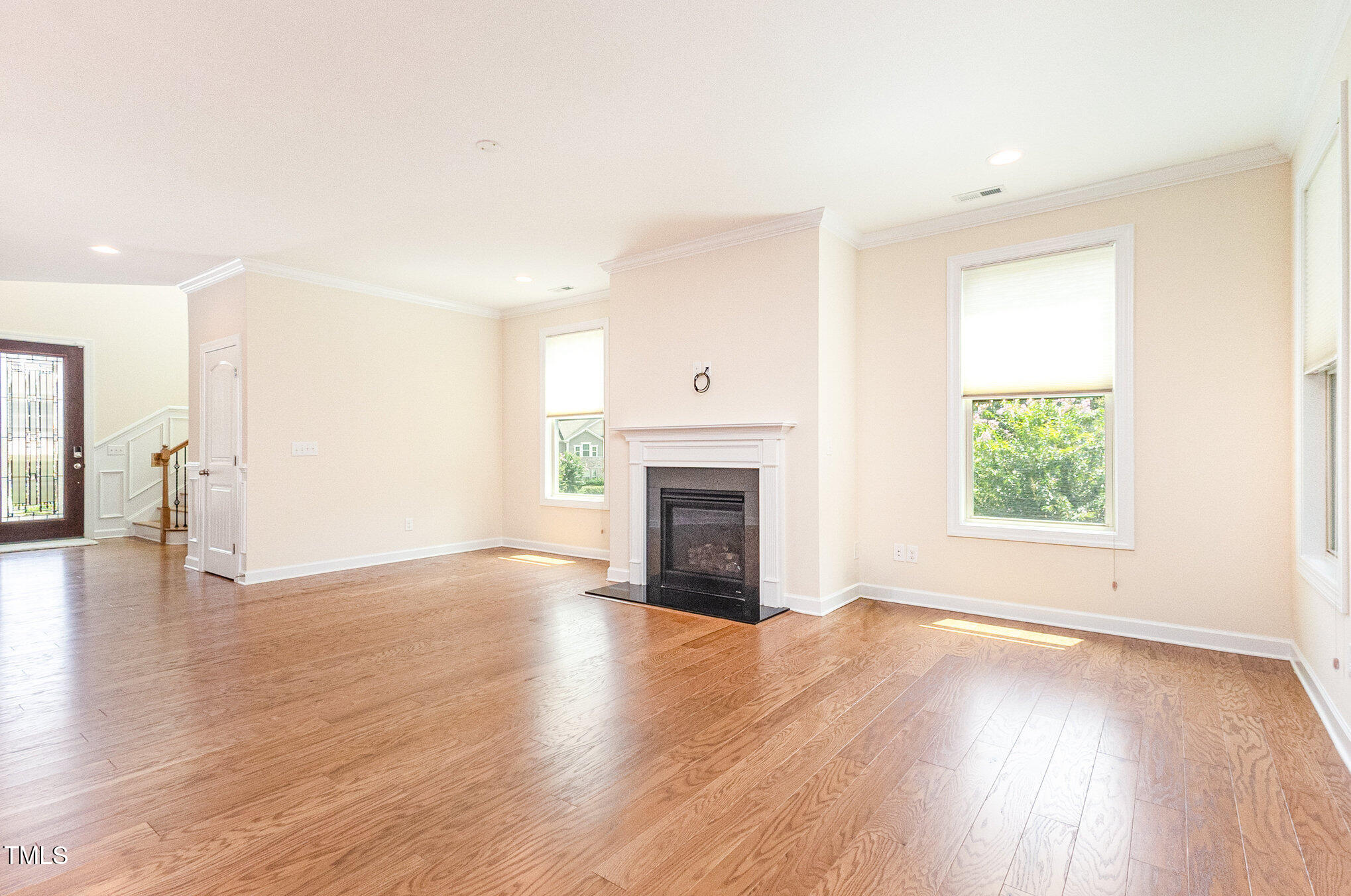 316 Matilda Place Cary, NC 27513 - Photo 18 of 69 a view of a livingroom with wooden floor and a fireplace