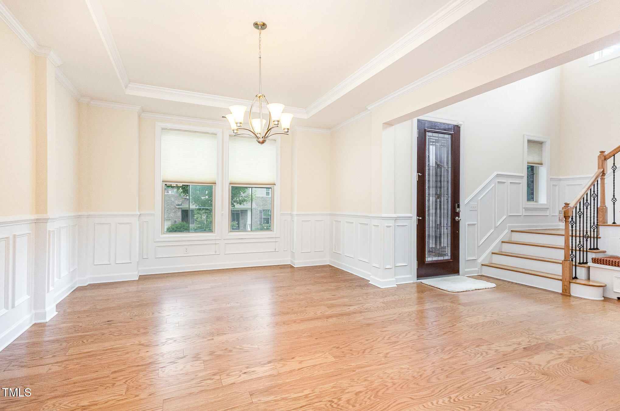 316 Matilda Place Cary, NC 27513 - Photo 23 of 69 a view of an empty room with wooden floor and a window
