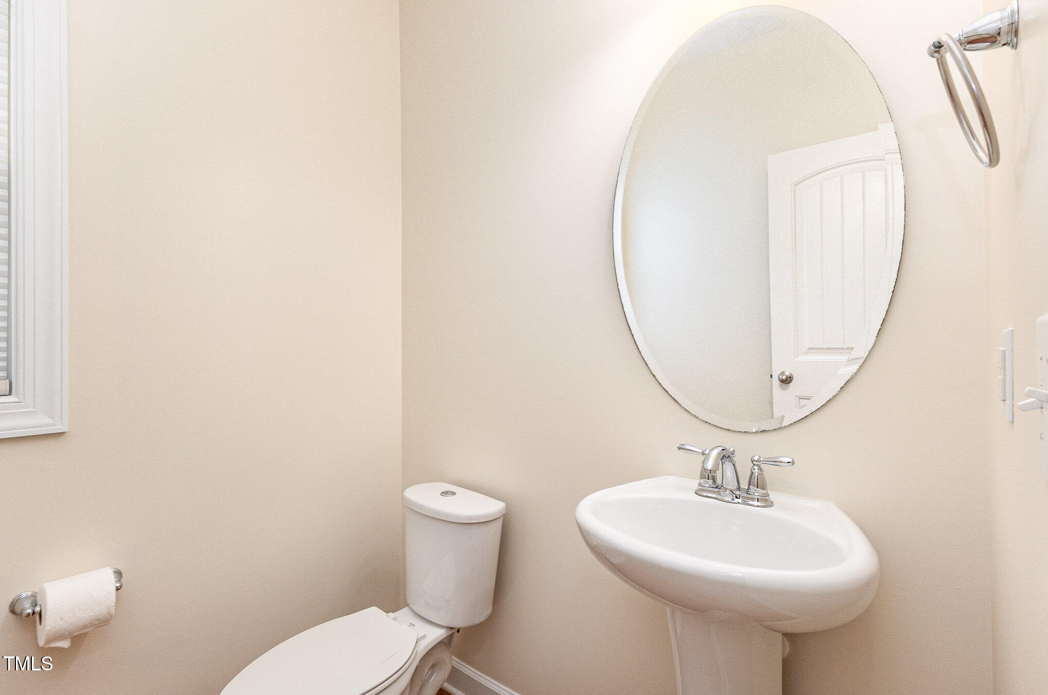 316 Matilda Place Cary, NC 27513 - Photo 31 of 69 a bathroom with a sink a mirror and a toilet