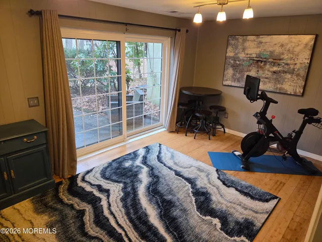 a bed sitting in a room next to a window