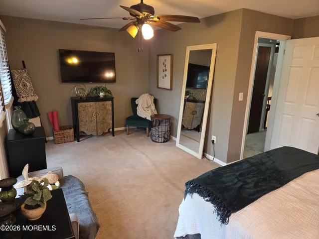 a bedroom with a bed and a walk in closet