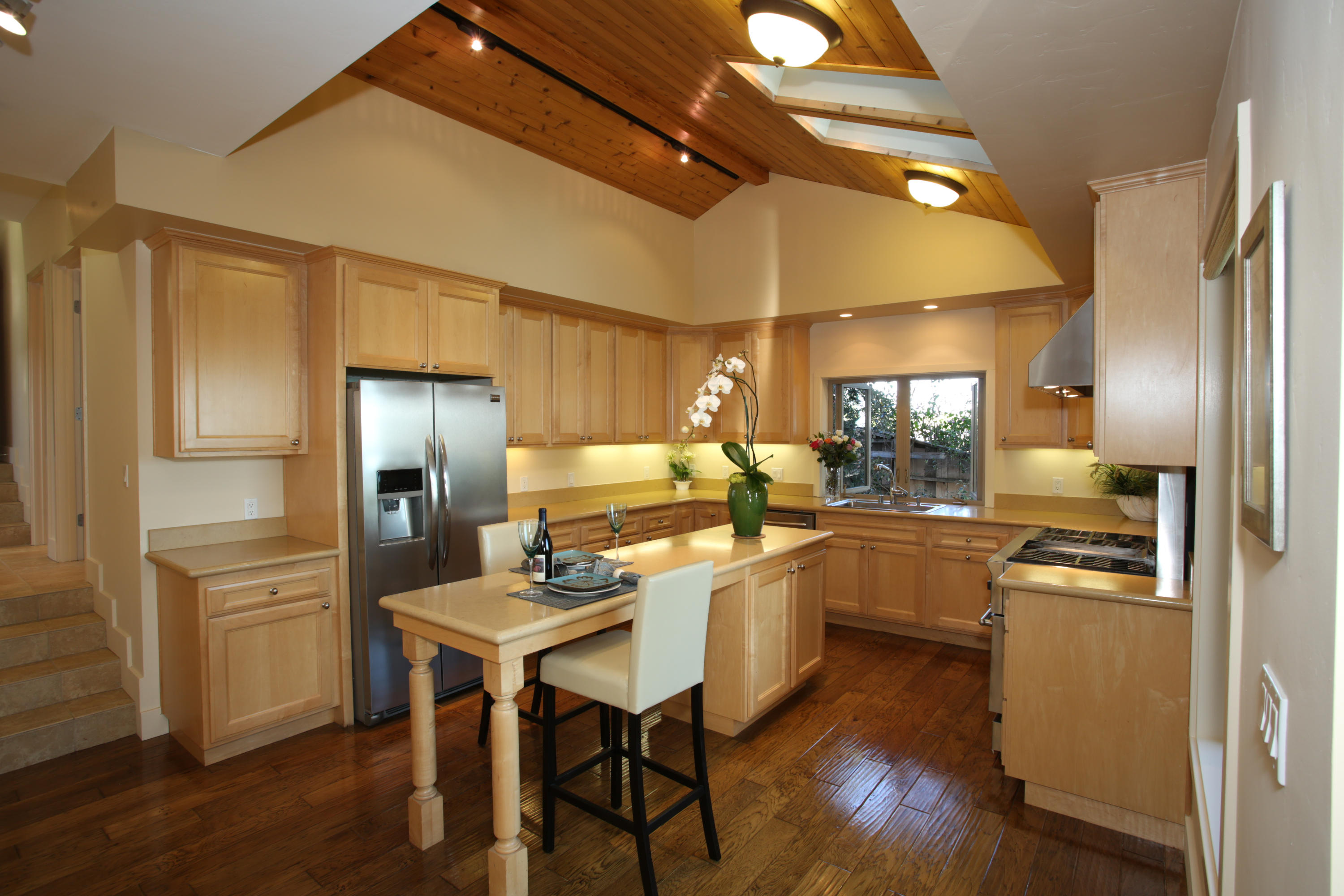 155 Cedar Lane Santa Barbara, CA 93108 - Photo 4 of 12 a kitchen with cabinets and stainless steel appliances