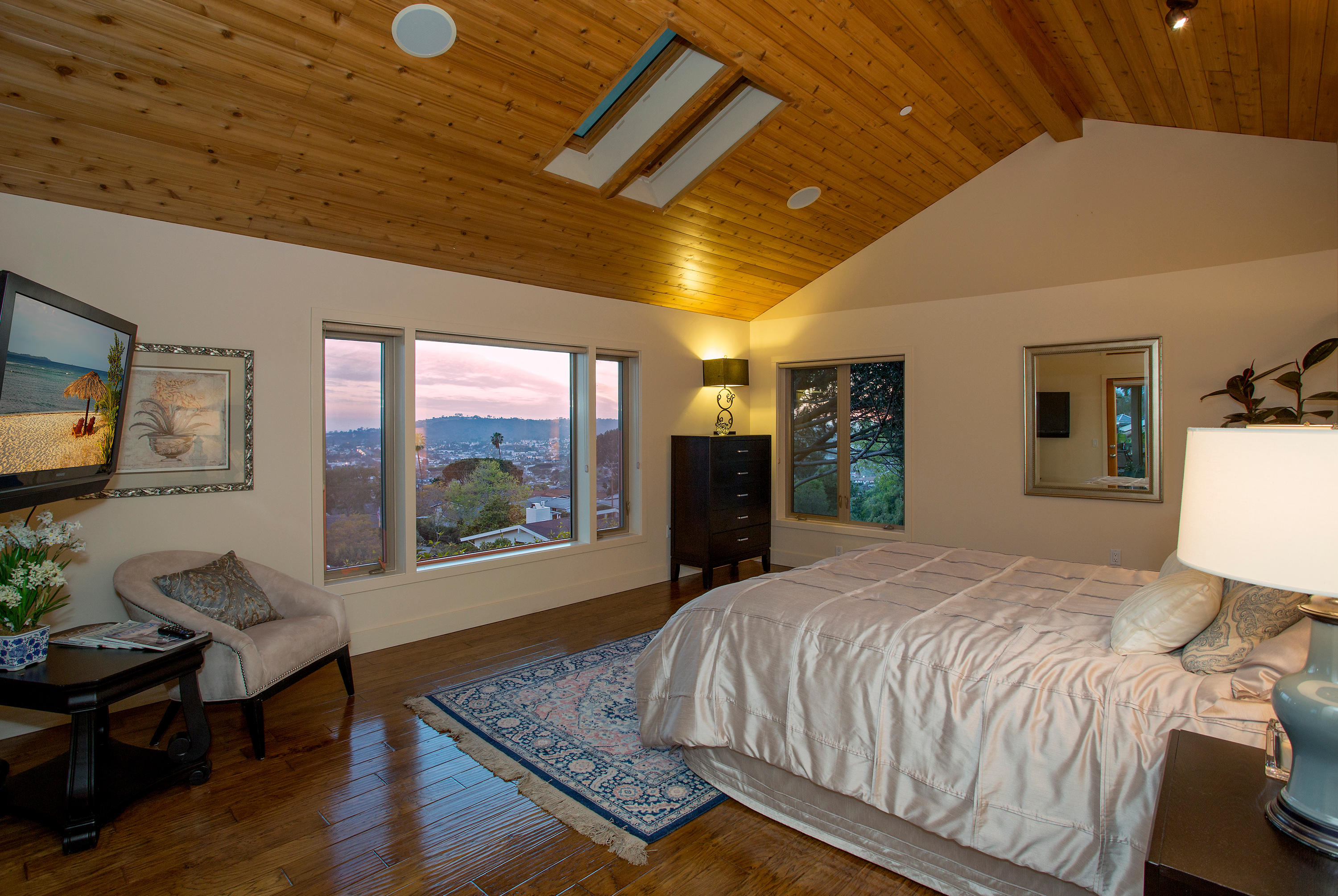 155 Cedar Lane Santa Barbara, CA 93108 - Photo 6 of 12 a bedroom with a large bed and a large window