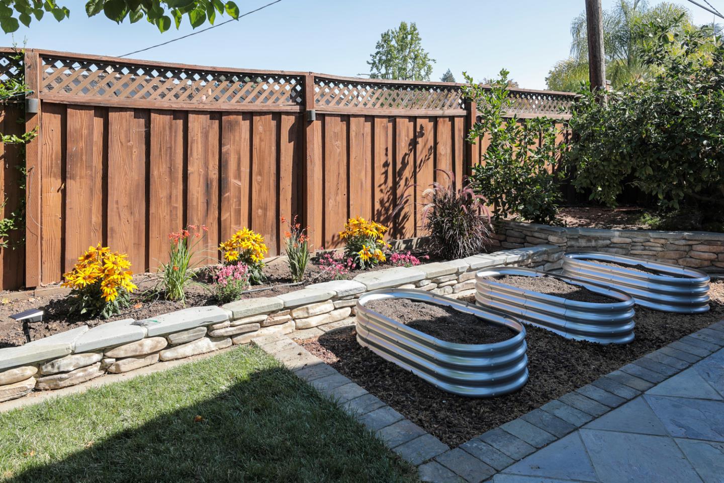 970 Gest Drive Mountain View, CA 94040 - Photo 27 of 53 a table and chairs sitting in backyard with plants