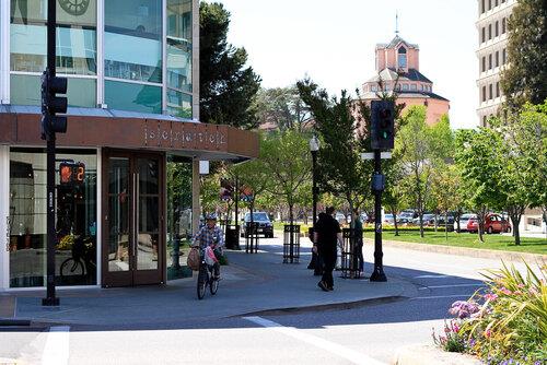 970 Gest Drive Mountain View, CA 94040 - Photo 50 of 53 a man walking down a street next to a building