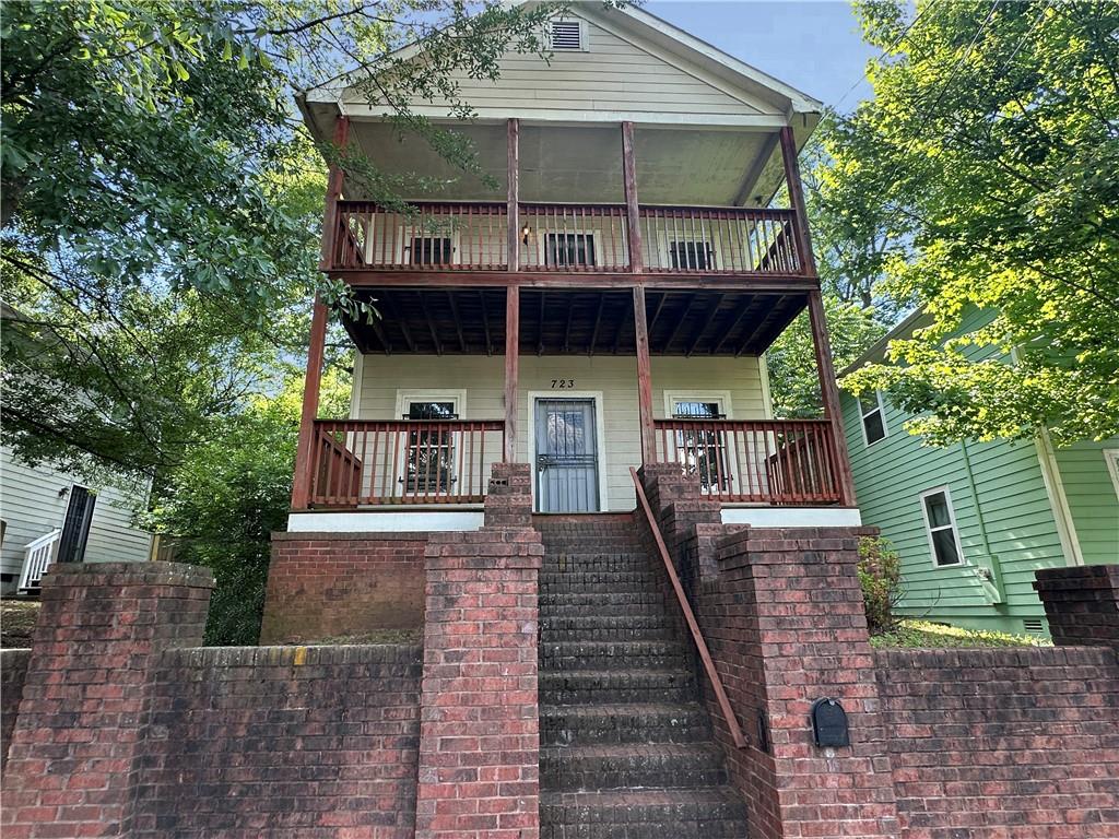 723 Cooper Street Southwest Atlanta, GA 30315 - Photo 1 of 1 a front view of a house with a balcony