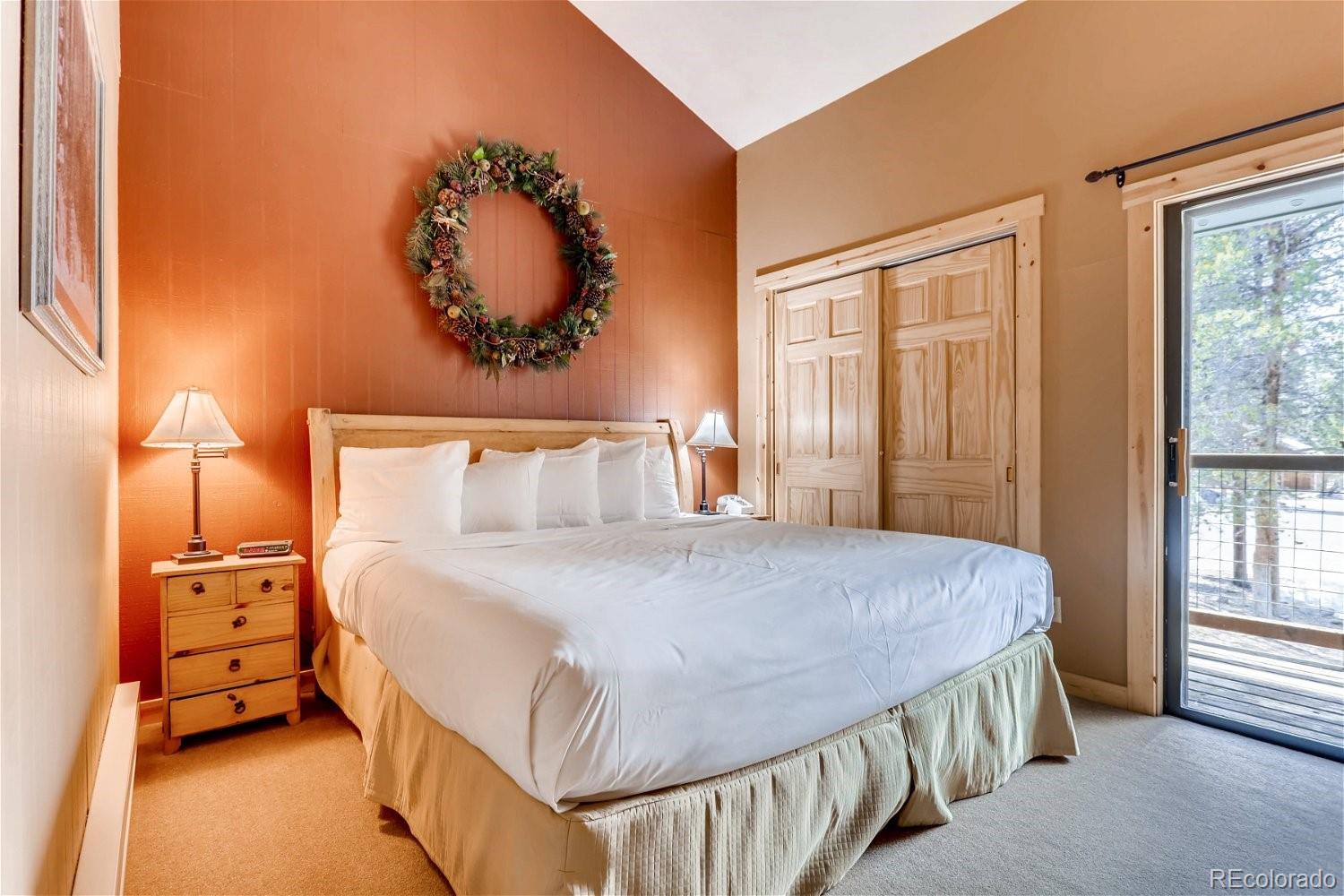 1937 Soda Ridge Road, Unit 1126 Dillon, CO 80435 - Photo 16 of 42 a bedroom with a bed and a window