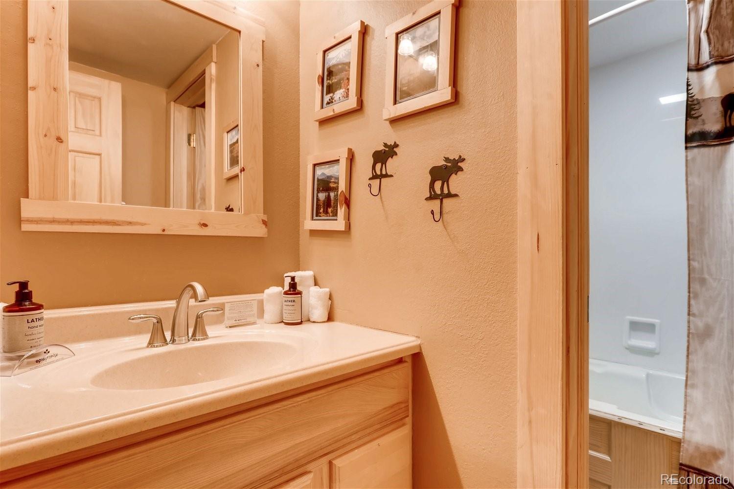 1937 Soda Ridge Road, Unit 1126 Dillon, CO 80435 - Photo 18 of 42 a bathroom with a sink and a mirror