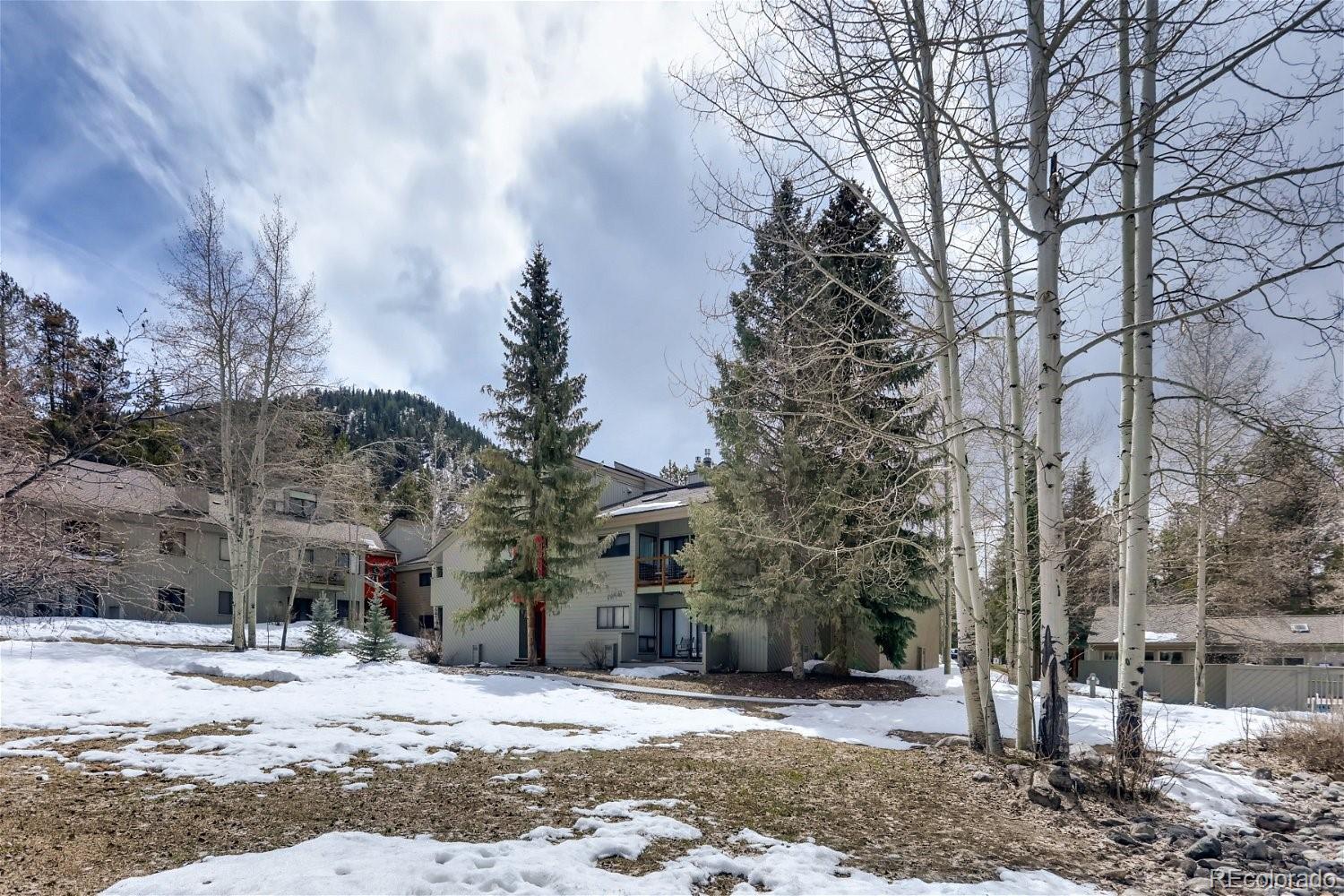 1937 Soda Ridge Road, Unit 1126 Dillon, CO 80435 - Photo 26 of 42 a street view with large trees