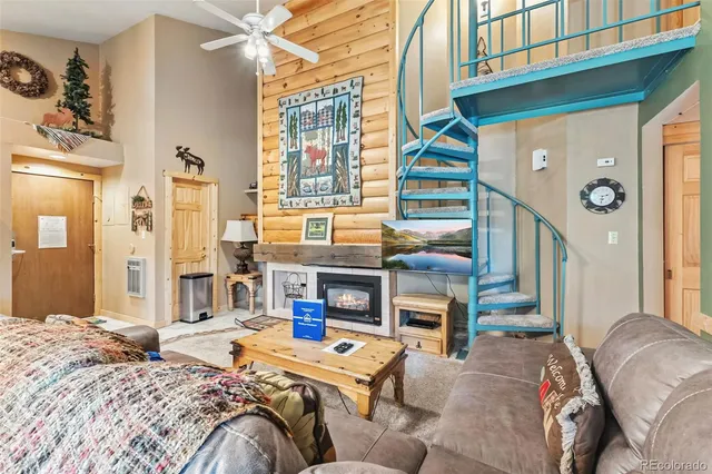 a bedroom with a bed and a fireplace