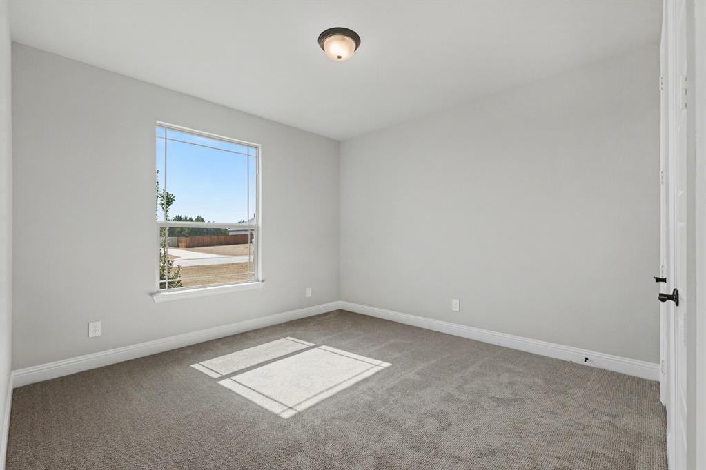 7041 Champion Road Midlothian, TX 76065 - Photo 23 of 30 an empty room with a window