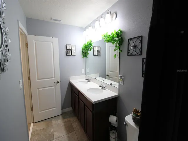 a living room filled with furniture and a large window