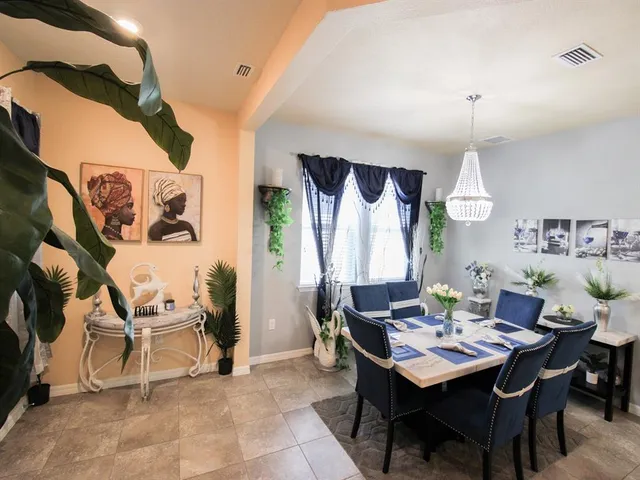 a view of a dining room with furniture