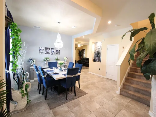 a kitchen with stainless steel appliances granite countertop a sink stove and microwave