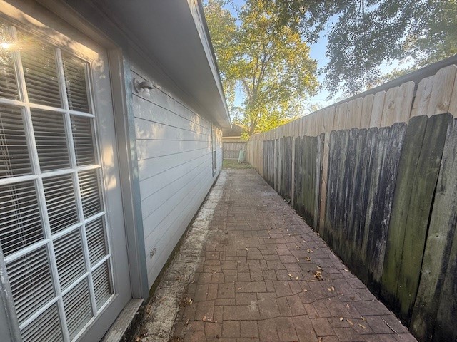 22122 Diane Drive Spring, TX 77373 - Photo 12 of 13 a view of a pathway of a house with wooden fence