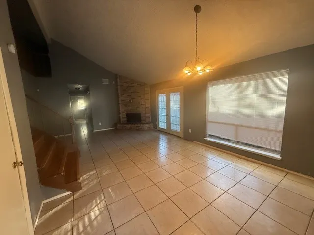 a view of a livingroom with furniture wooden floor and window
