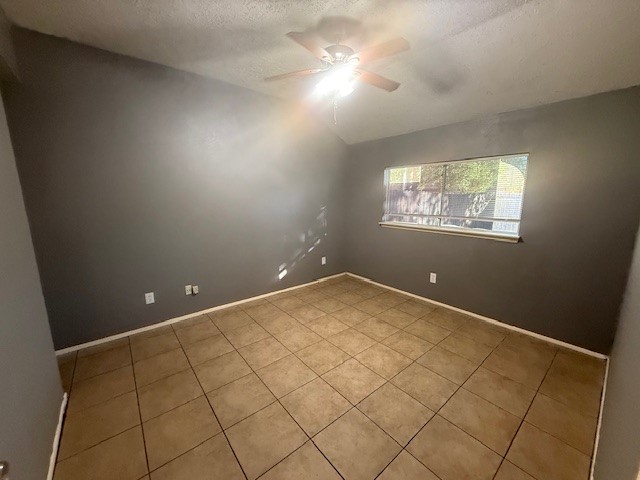 22122 Diane Drive Spring, TX 77373 - Photo 7 of 13 an empty room with windows and ceiling fan