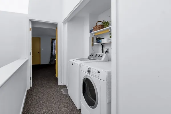a utility room with dryer and washer