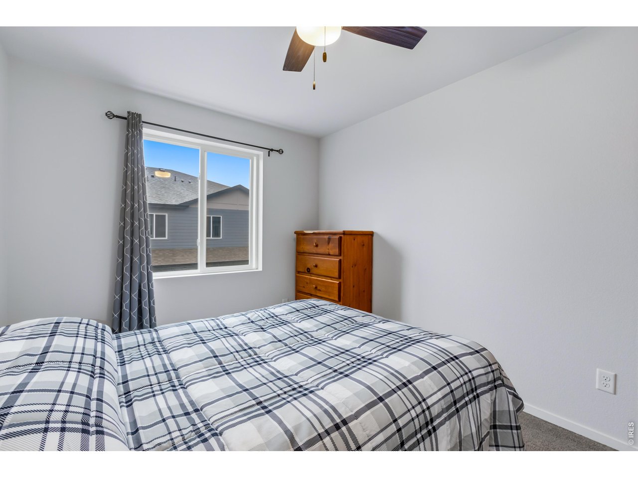 6609 4th St Road, Unit 4 Greeley, CO 80634 - Photo 27 of 41 a bedroom with a bed and a window