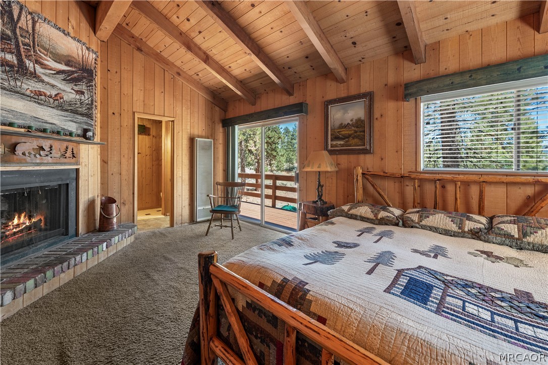 39625 Flicker Road Fawnskin, CA 92333 - Photo 7 of 47 Fireplace in the primary bedroom offers a romantic ambiance