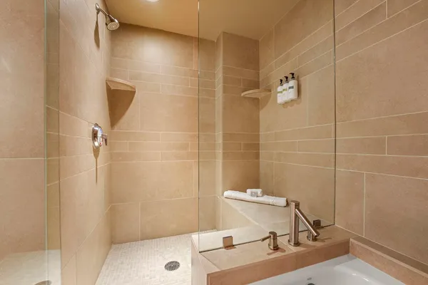 a bathroom with a sink toilet and shower