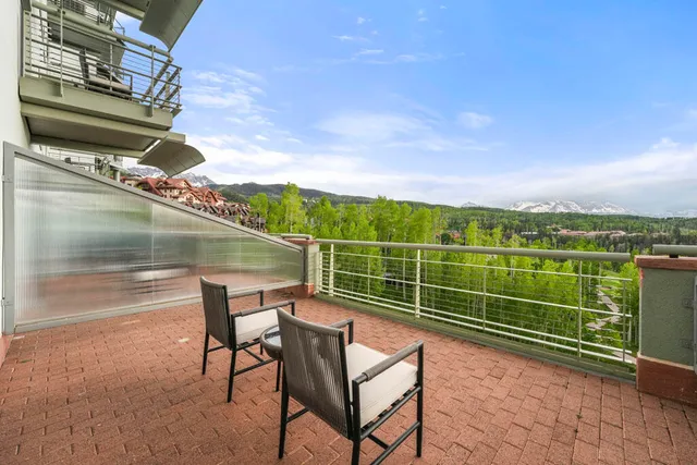 a view of a chairs and table on the terrace