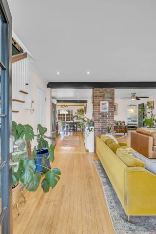 a large kitchen with stainless steel appliances granite countertop a lot of counter space and wooden floor