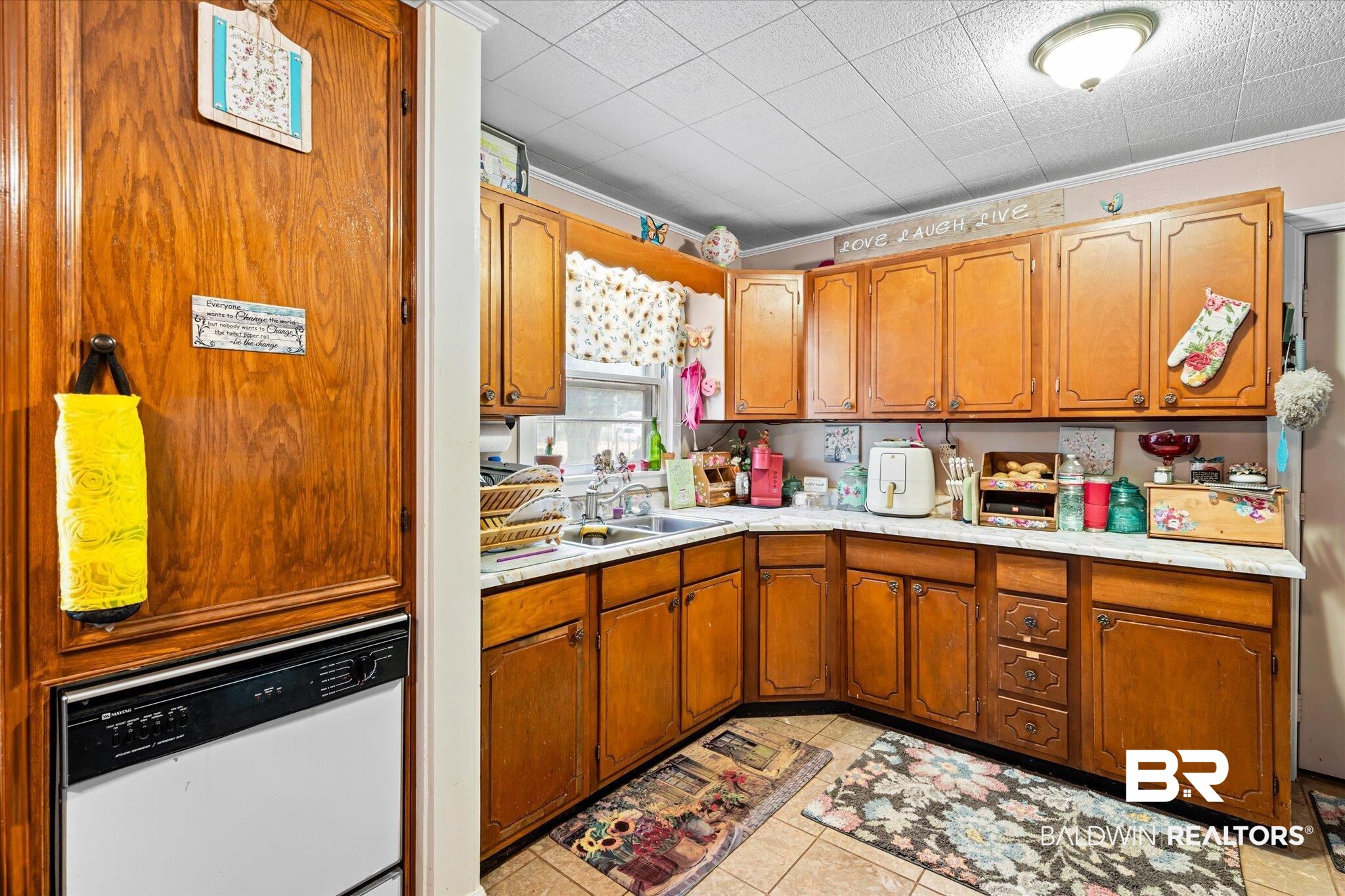 4575 Bush Lane Mobile, AL 36619 - Photo 7 of 20 Kitchen featuring sink, crown molding, white dishwasher, and light tile patterned flooring