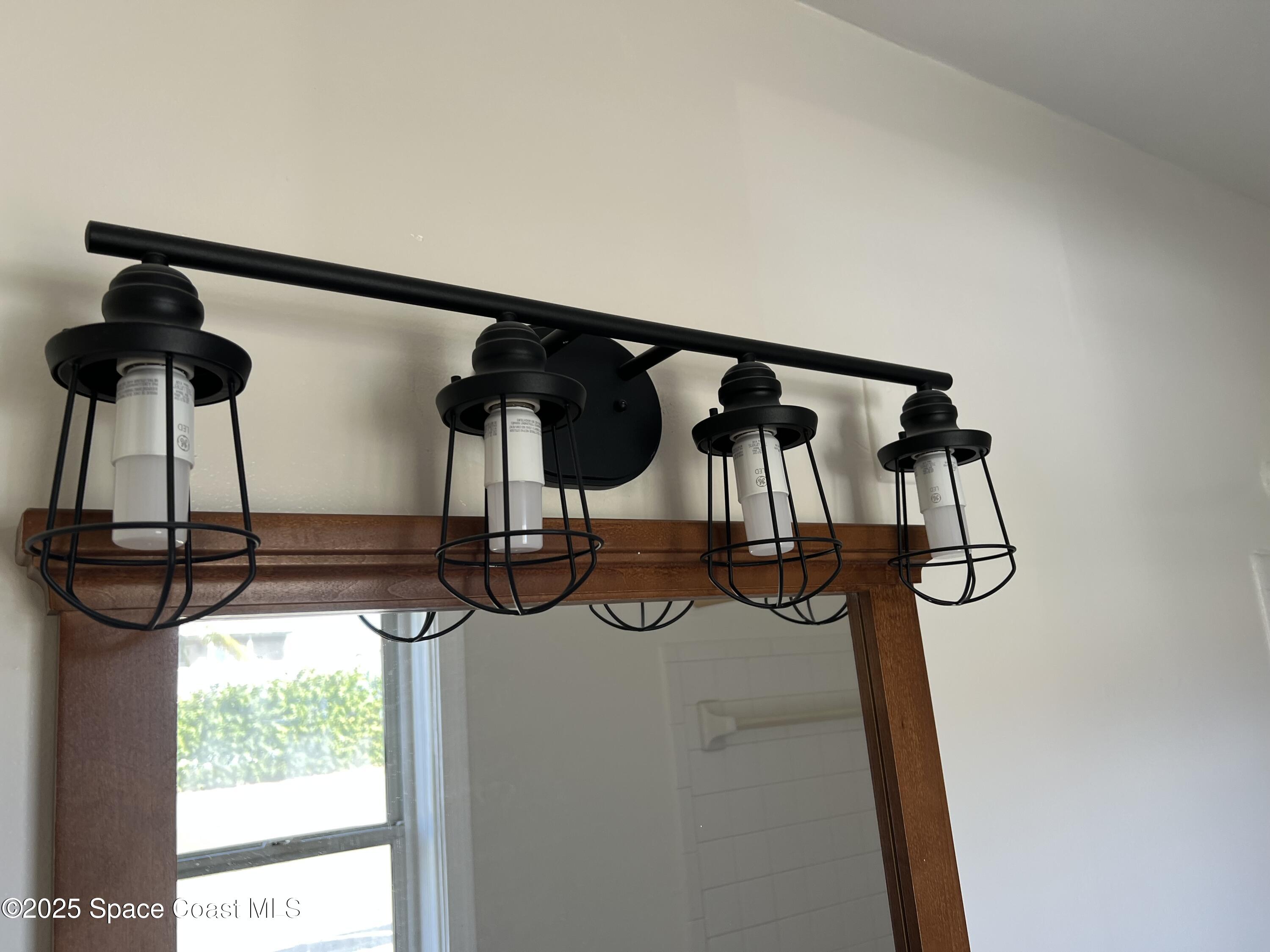 931 Palm Springs Boulevard, Unit B Indian Harbour Beach, FL 32937 - Photo 11 of 16 a view of a room with gym equipment