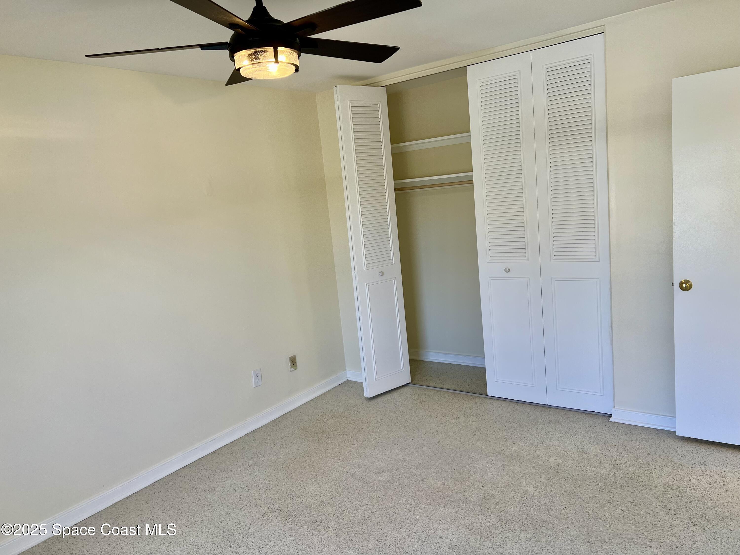 931 Palm Springs Boulevard, Unit B Indian Harbour Beach, FL 32937 - Photo 10 of 16 a view of an empty room