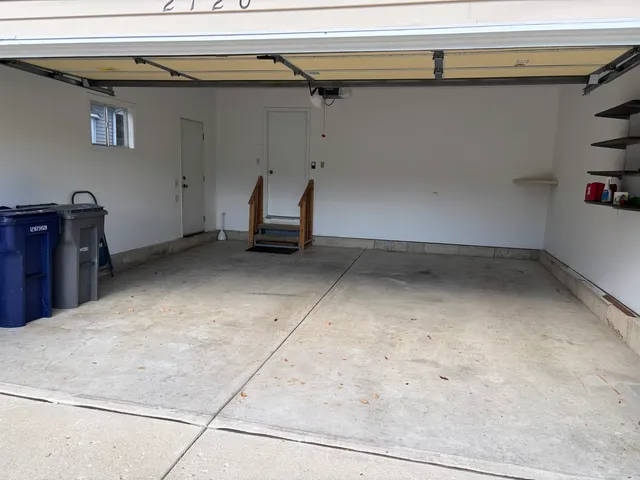 a bedroom with a bed and cabinets