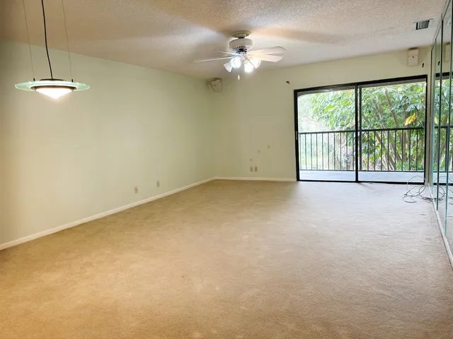 an empty room with a empty space and a fireplace