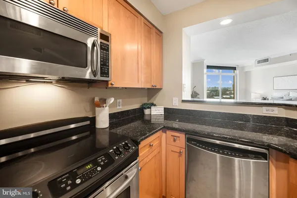 a kitchen with a stove and a microwave