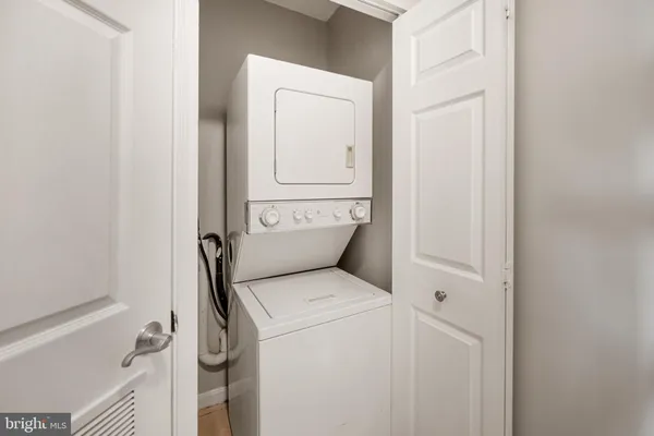 a view of bathroom with a washer and dryer