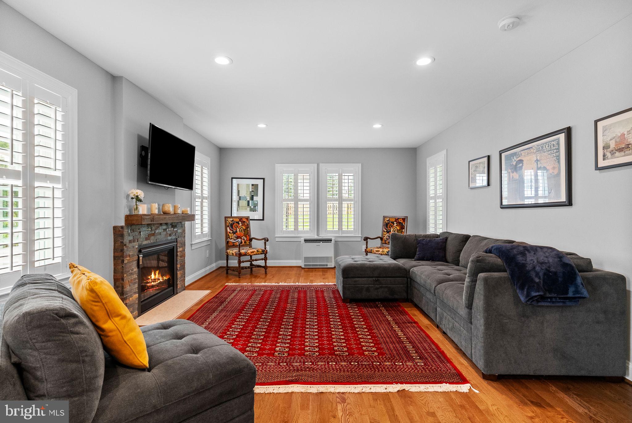 337 Old Lancaster Road Devon, PA 19333 - Photo 16 of 56 a living room with fireplace furniture and a flat screen tv